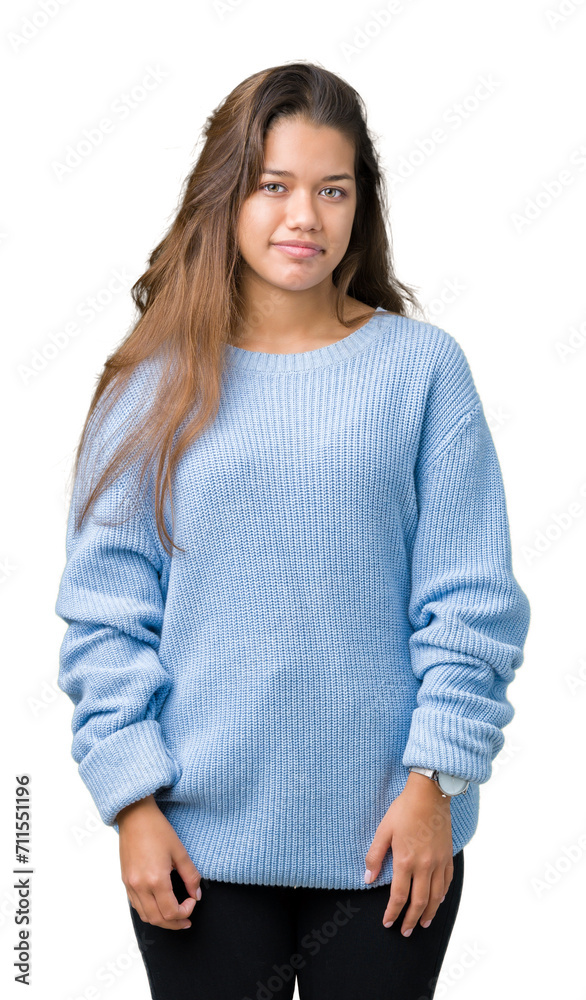 Young beautiful brunette woman wearing blue winter sweater over isolated background Relaxed with serious expression on face. Simple and natural looking at the camera. Young beautiful brunette woman wearing blue winter sweater over isolated background Relaxed with serious expression on face. Simple and natural looking at the camera.