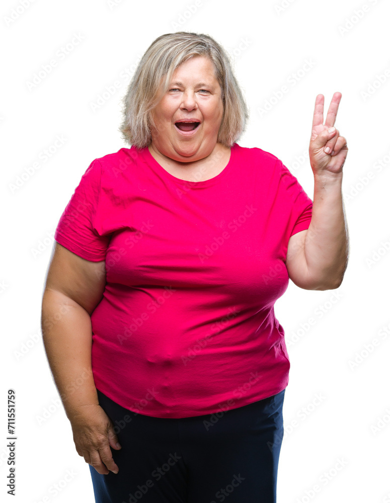 Fototapeta premium Senior plus size caucasian woman over isolated background smiling with happy face winking at the camera doing victory sign. Number two.