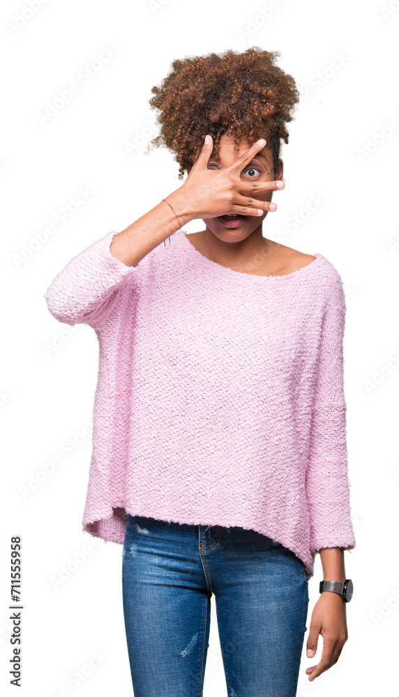 Beautiful young african american woman wearing glasses over isolated background peeking in shock covering face and eyes with hand, looking through fingers with embarrassed expression. Beautiful young african american woman wearing glasses over isolated background peeking in shock covering face and eyes with hand, looking through fingers with embarrassed expression.
