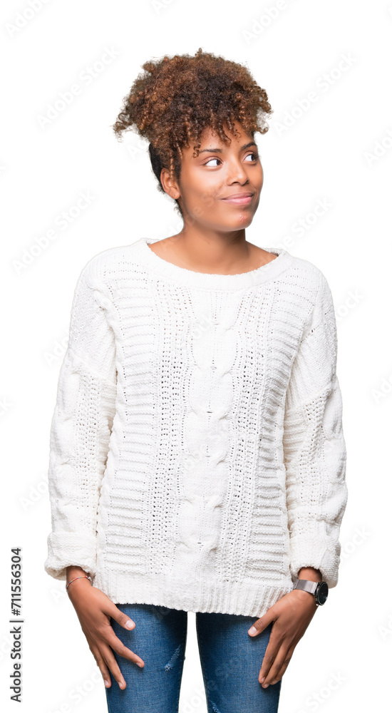 Beautiful young african american woman wearing winter sweater over isolated background smiling looking side and staring away thinking. Beautiful young african american woman wearing winter sweater over isolated background smiling looking side and staring away thinking.