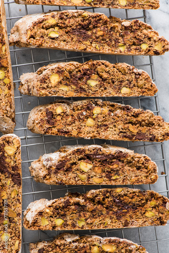 Home baked chocolate and pistachio biscotti cooling on a rack