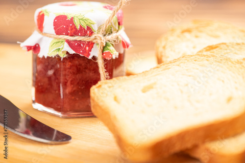 Jam and toast, jar of jam and toast on rustic wood. Selective focus.