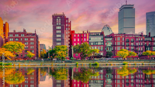 Boston Back Bay Vibrant Skyline, Buildings, and Water Reflections at sunset on the Charles River. Colorful Modern City autumn landscape in New England of America. photo