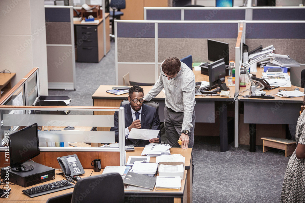 Colleagues with diverse backgrounds working, talking and hanging out in large office space. Cape Town, South Africa Colleagues with diverse backgrounds working, talking and hanging out in large office space. Cape Town, South Africa