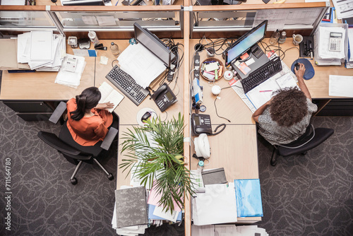 Colleagues with diverse backgrounds working, talking and hanging out in large office space. Cape Town, South Africa