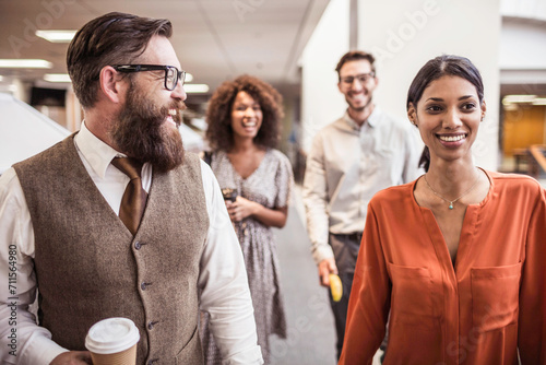 Colleagues with diverse backgrounds working, talking and hanging out in large office space. Cape Town, South Africa