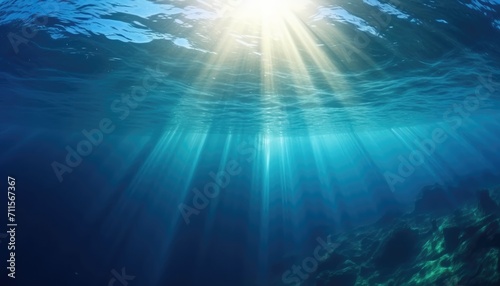 Blue ocean underwater with sunrays reaching background © Eyepain