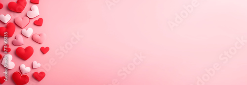 Valentine's Day. Pink hearts, flat lay, background with empty space in the center. Love concept. Lots of decorative hearts on a light background. For postcards
