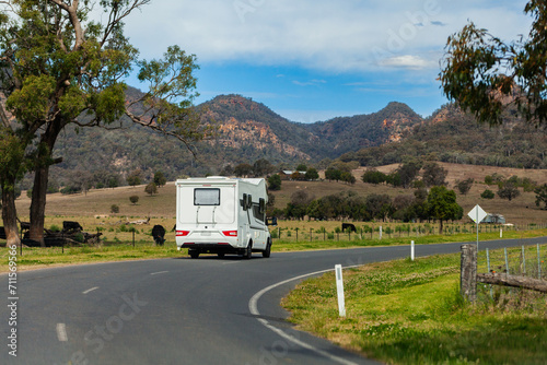 Campervan travelling on road in rural NSW australia photo
