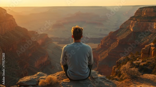 Man looking into a vast canyon with his back turned generative ai