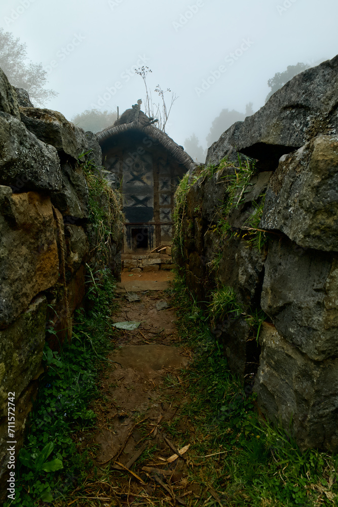 Quaint Toda tribe hut in a rocky landscape. Tamil Nadu, India Quaint Toda tribe hut in a rocky landscape. Tamil Nadu, India
