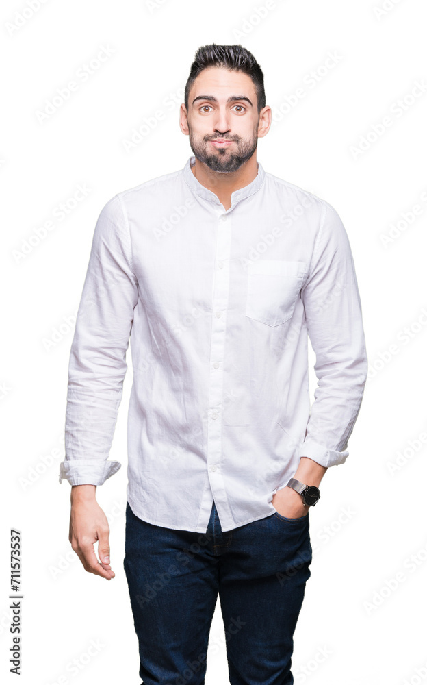 Fototapeta premium Young business man over isolated background puffing cheeks with funny face. Mouth inflated with air, crazy expression.