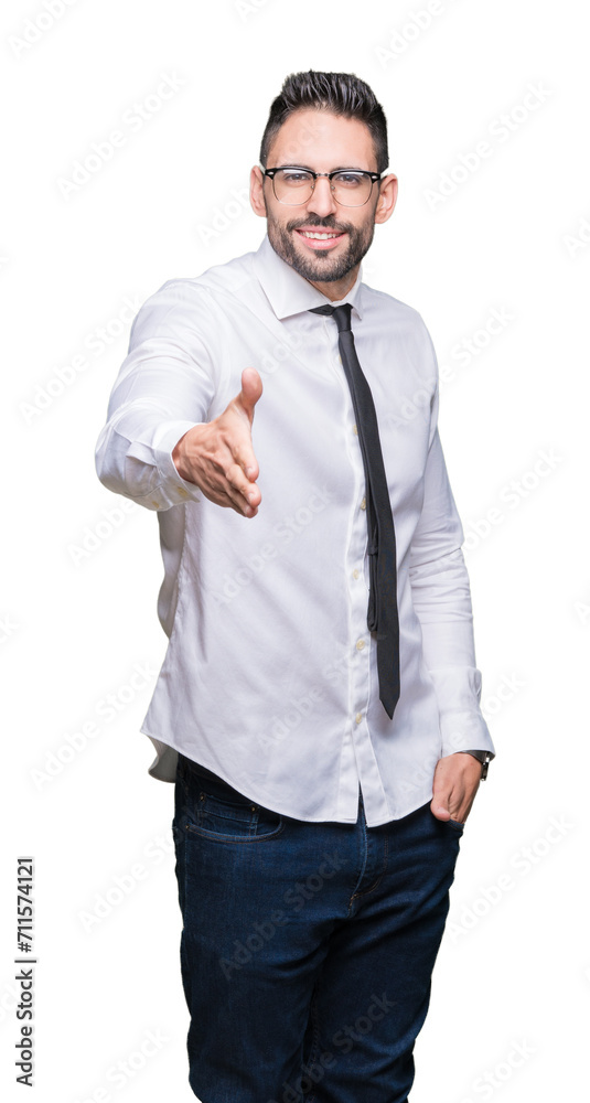 Young handsome business man wearing glasses over isolated background smiling friendly offering handshake as greeting and welcoming. Successful business. Young handsome business man wearing glasses over isolated background smiling friendly offering handshake as greeting and welcoming. Successful business.
