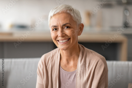 Portrait Of Smiling Senior Lady With Gray Short Hair Indoors