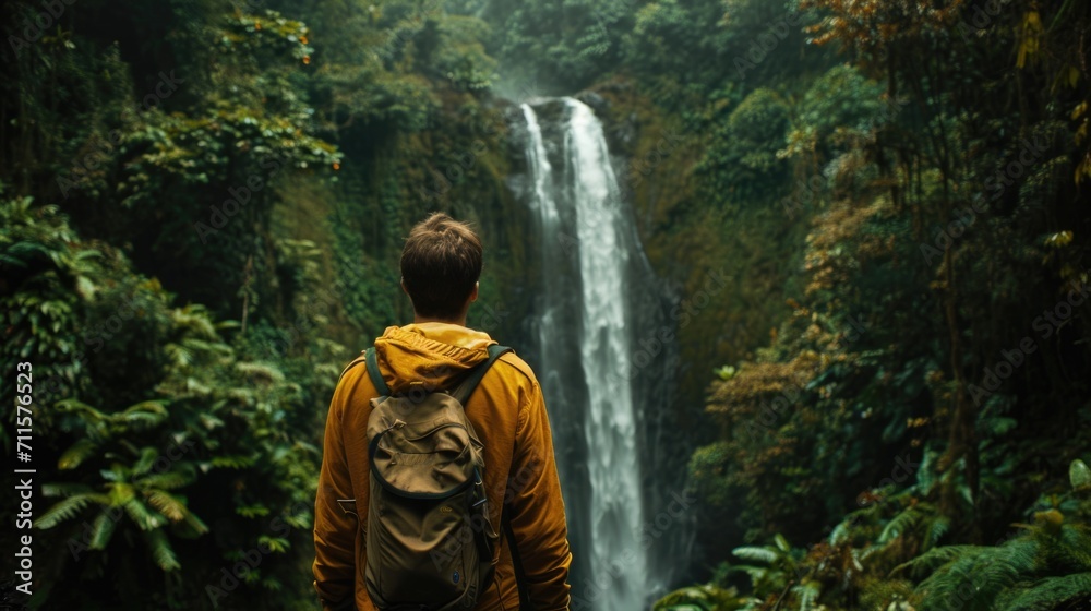 Man looking towards a distant waterfall generative ai