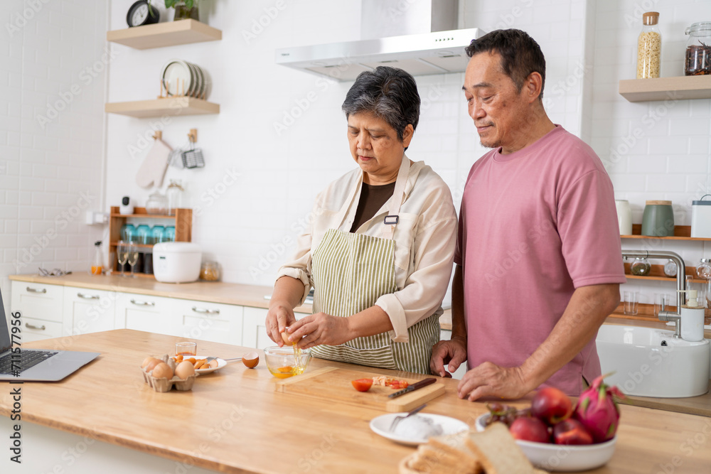 Mature asian Couples enjoy to cooking meal together in kitchen. Mature asian Couples enjoy to cooking meal together in kitchen.