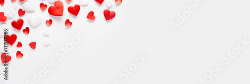 Valentine's Day. Pink and white hearts, flat lay, background with empty space in the center. Love concept. Many decorative hearts on a white background. For postcards