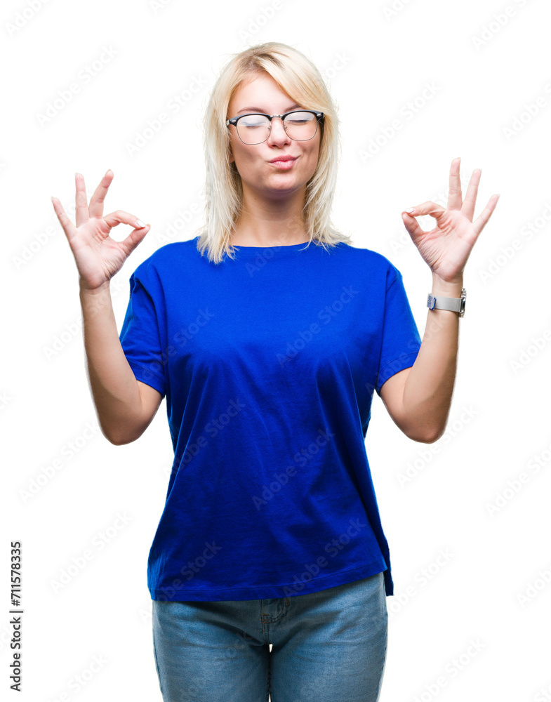 Young beautiful blonde woman wearing glasses over isolated background relax and smiling with eyes closed doing meditation gesture with fingers. Yoga concept. Young beautiful blonde woman wearing glasses over isolated background relax and smiling with eyes closed doing meditation gesture with fingers. Yoga concept.