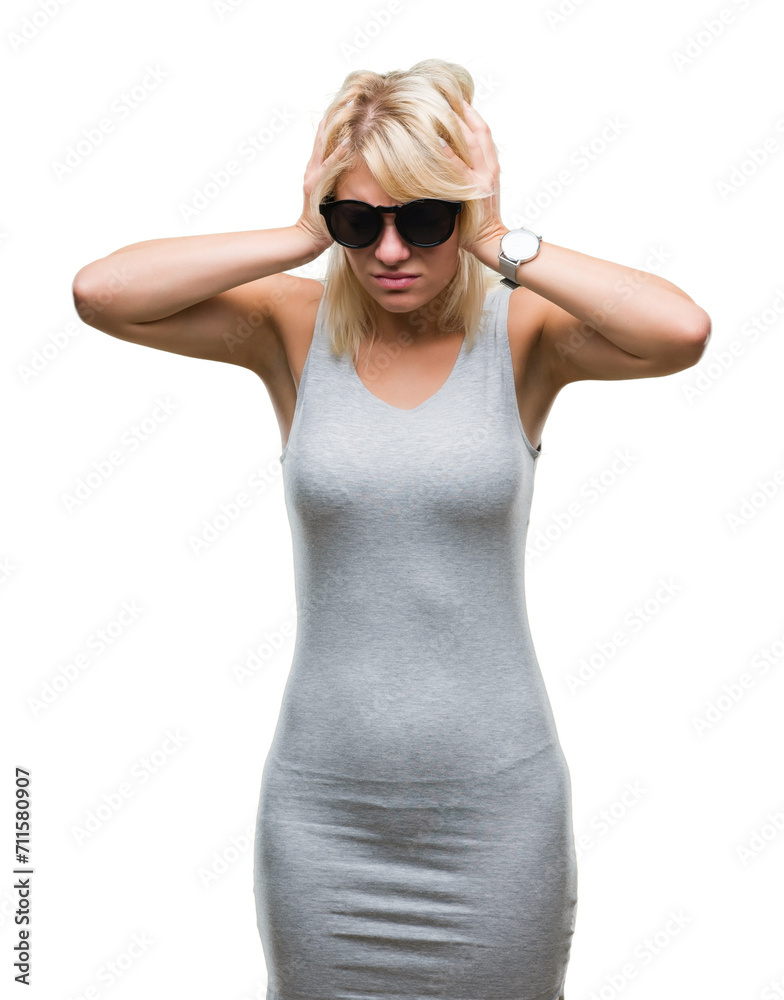 Young beautiful blonde woman wearing sunglasses over isolated background suffering from headache desperate and stressed because pain and migraine. Hands on head. Young beautiful blonde woman wearing sunglasses over isolated background suffering from headache desperate and stressed because pain and migraine. Hands on head.