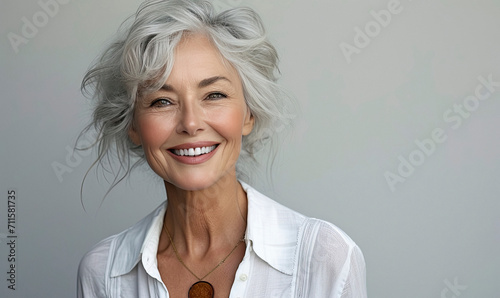 50s middle aged old woman looking at camera isolated on white background advertising dry skin care treatment anti age skincare beauty, plastic surgery, cosmetology procedures.