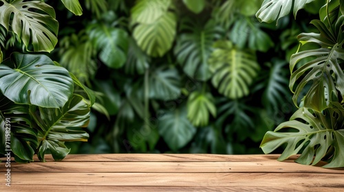 Wood podium between green plant leaves with space for placing products