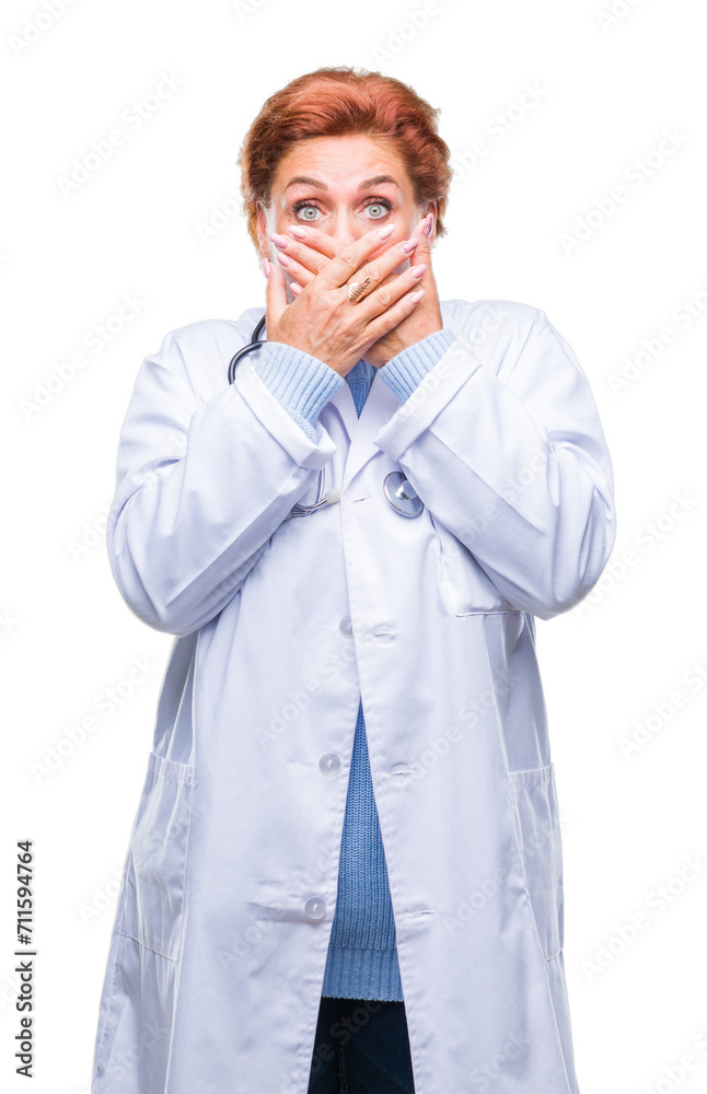 Senior caucasian doctor woman wearing medical uniform over isolated background shocked covering mouth with hands for mistake. Secret concept.
