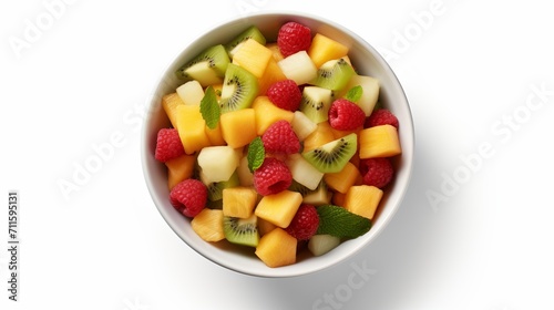 Fresh and colorful bowl of healthy fruit salad  top view isolated on white background