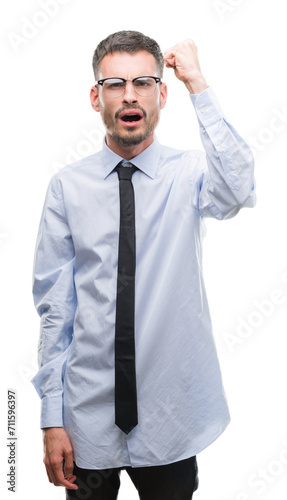 Young business man annoyed and frustrated shouting with anger, crazy and yelling with raised hand, anger concept © Krakenimages.com