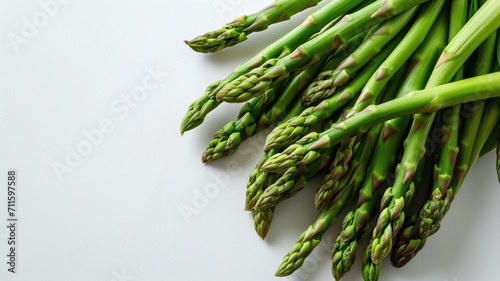 Fresh green asparagus on a clean white background photo
