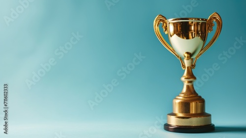 Golden trophy on a teal blue background