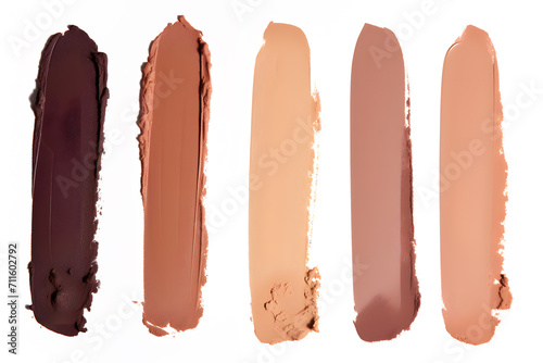 Swatches of liquid foundation makeup in different skin shades on white background photo