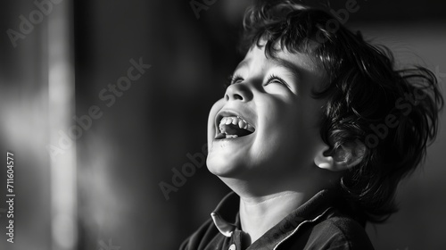 Portrait of a child caught in candid laughter