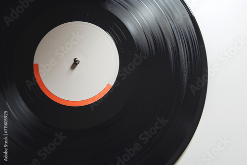 Close-up of a vinyl record with a red and orange label