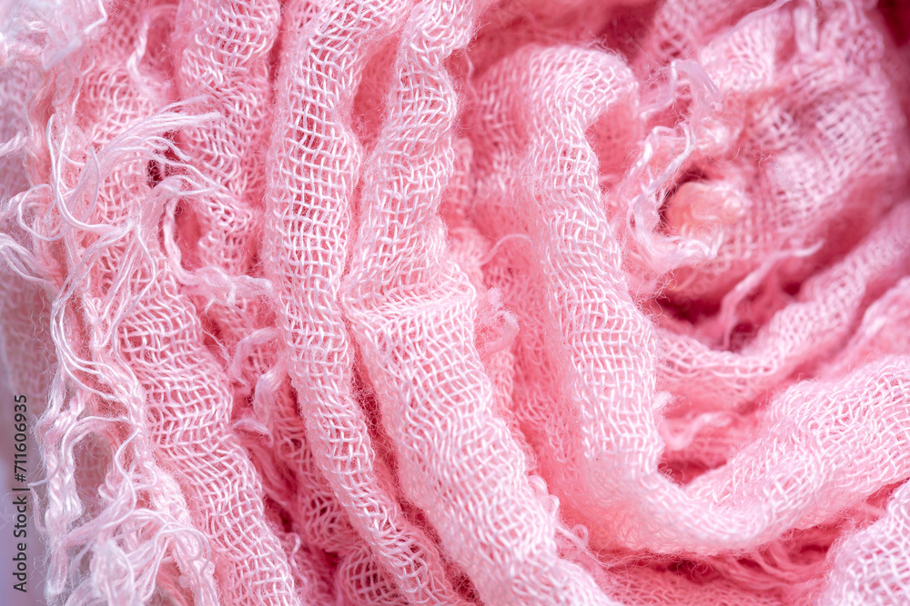 Pink cloth roll,Macro close range,Pile of folded pink blankets. Rolls of pink plaids lie on a shelf, texture effect. 