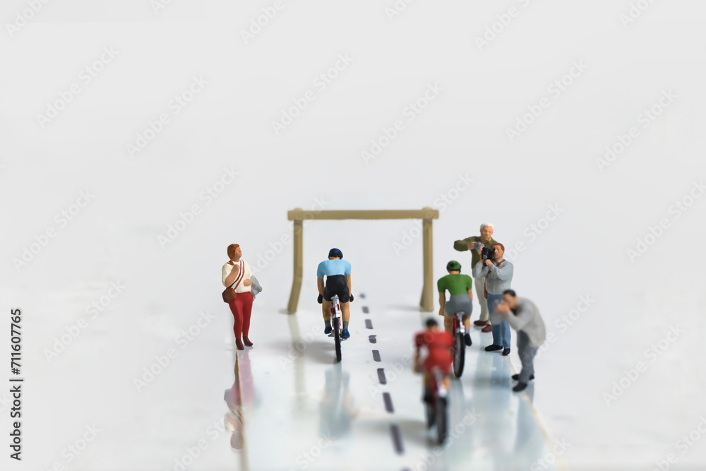 Cycling race shortly before the finish, miniature figures scene, white background
Cycling race shortly before the finish, miniature figures scene, white background
