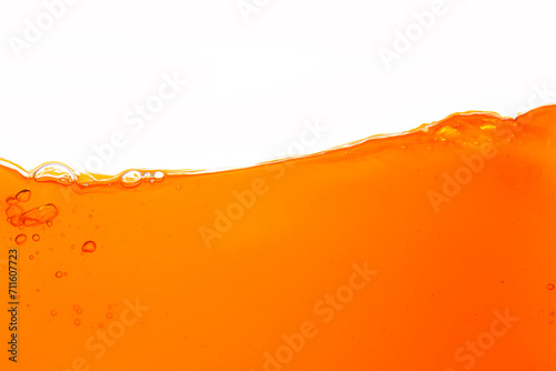 Macro orange juice texture isolated white background,Close up bright orange juice texture for health and nature waves
