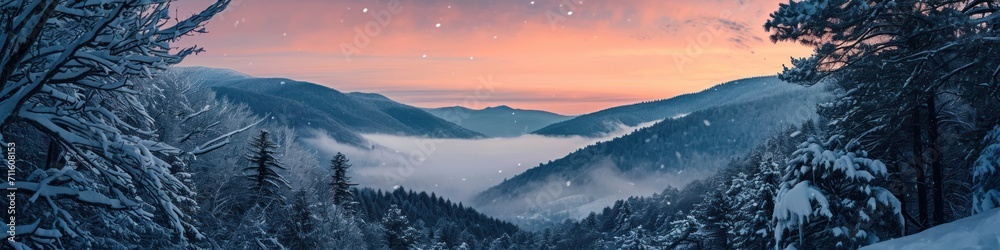 Dramatic overlook of a snowy valley at twilight