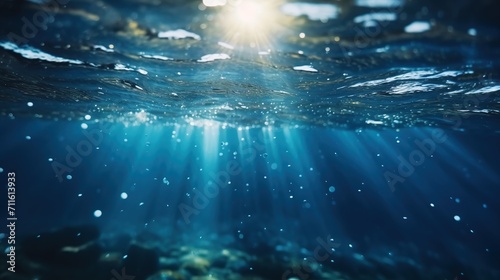 Sun rays in the water. Bubbles under water. Underwater world. Sun rays under water.