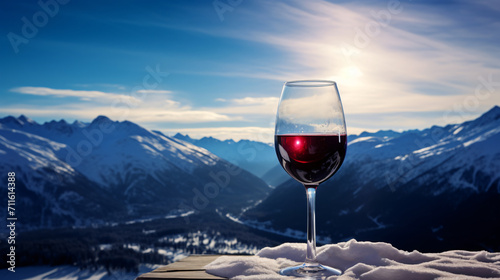 A glass of red wine on a snowy landscape in winter, in the style of photo-realistic landscapes, mountainous vistas

