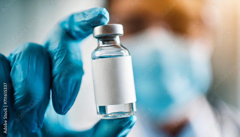 Hand in medical glove holds a vaccine vial, symbolizing hope and protection against infectious diseases