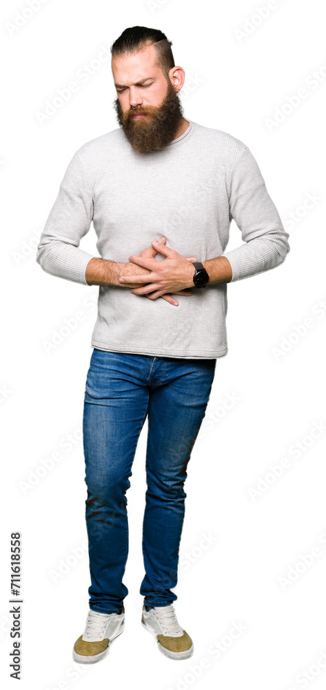 Young blond man wearing casual sweater with hand on stomach because indigestion, painful illness feeling unwell. Ache concept. Young blond man wearing casual sweater with hand on stomach because indigestion, painful illness feeling unwell. Ache concept.