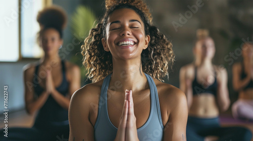 Portrait of smiling people doing yoga in gym