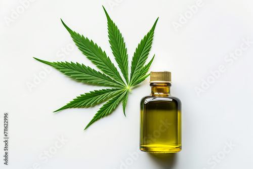 CBD cannabis oil bottle with green marijuana leafs isolated on white background with copy space