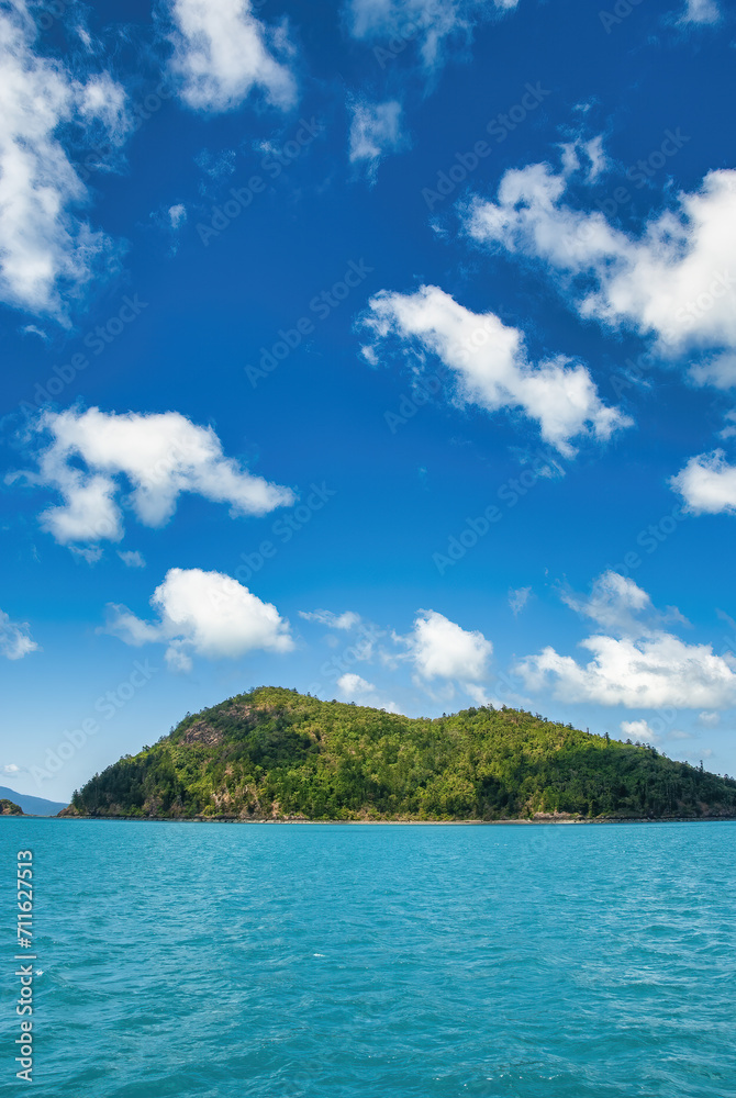 Tropical island with crystal clear water and beautiful blue sky. Travel and holiday concept