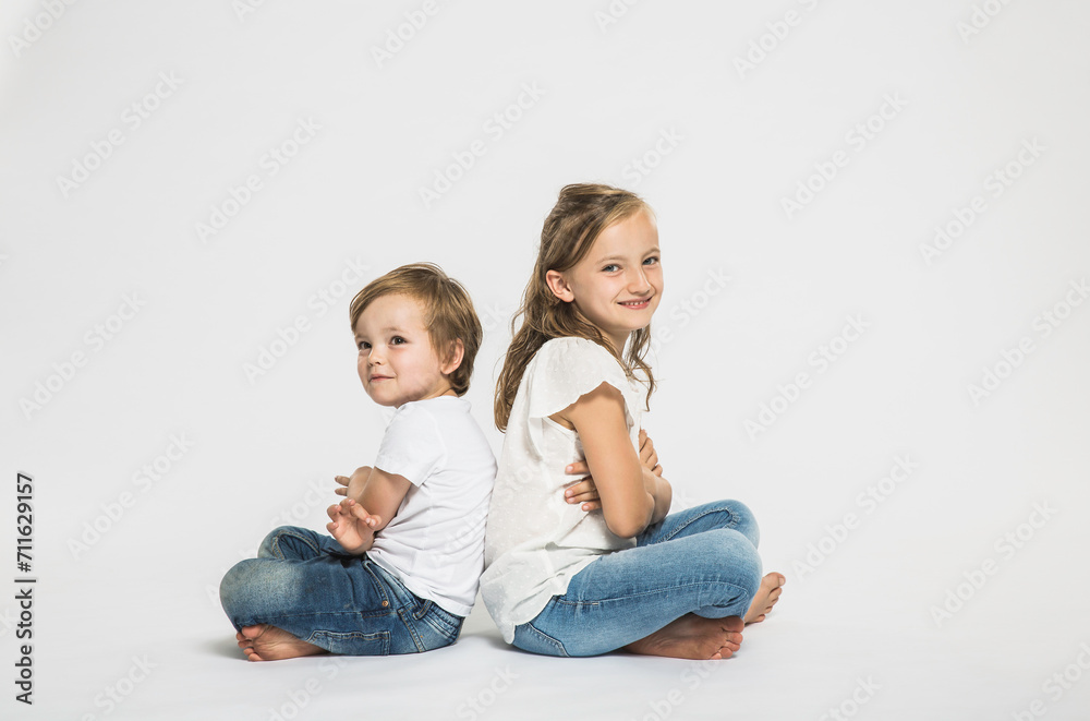 Portrait of two children in studio with white background. Portrait of two children in studio with white background.