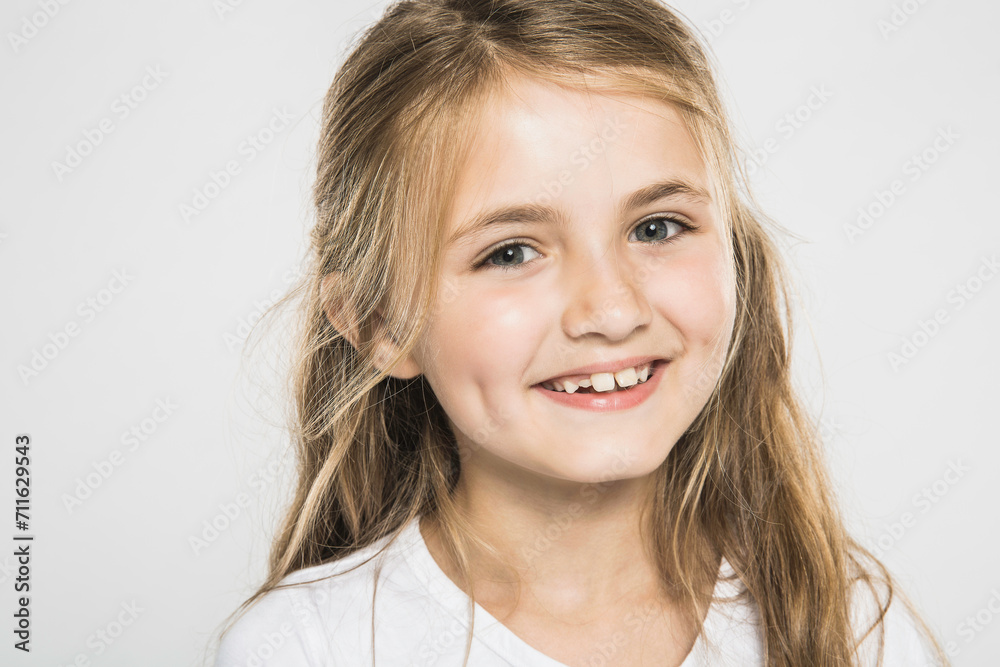 Portrait of young girl in studio with white background. Portrait of young girl in studio with white background.