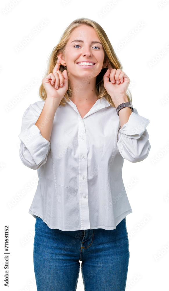 Beautiful young business woman over isolated background Smiling pulling ears with fingers, funny gesture. Audition problem Beautiful young business woman over isolated background Smiling pulling ears with fingers, funny gesture. Audition problem