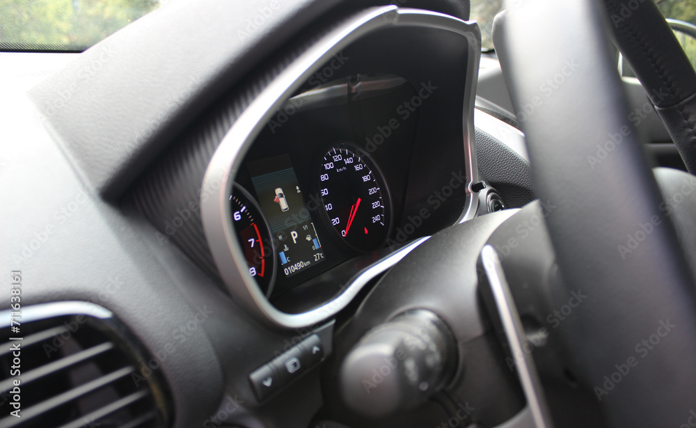 Steering Wheel, Shifter And Backlight Of Central Dashboard Inside Car Detailed Side View 
