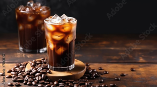 Ice coffee and coffee beans on a old brown table. Copy space.
