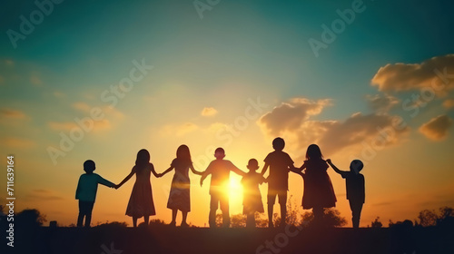 silhouette of family on sunset background